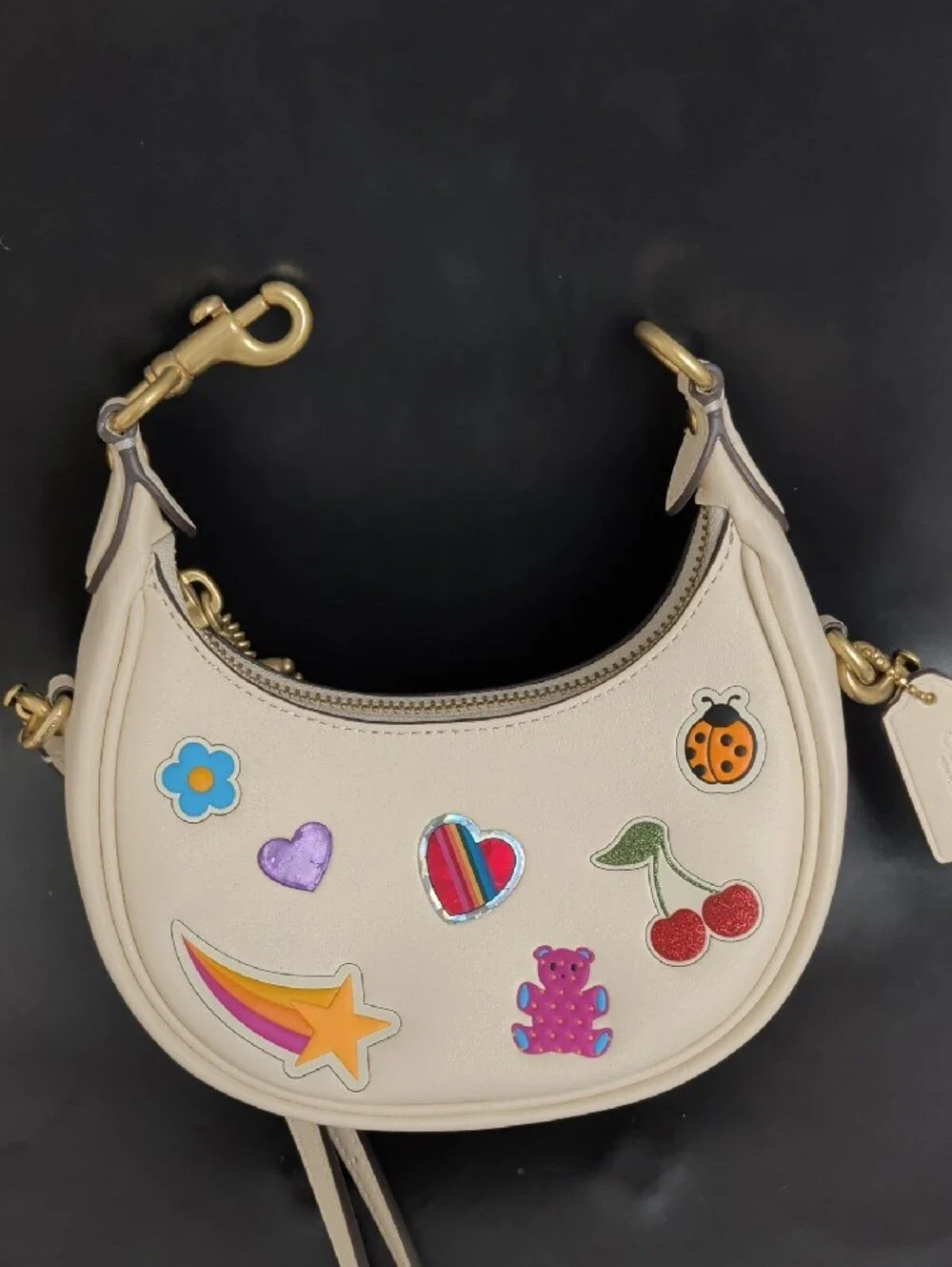 Cream Mini Crescent Crossbody Bag with Playful Patch Motifs